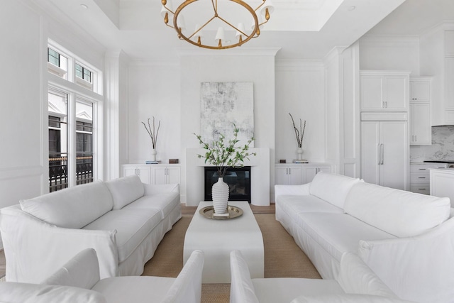 living area featuring a chandelier