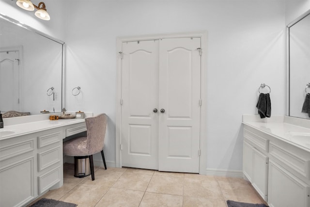 11409 E Zoe Loop Dr, Montgomery, TX 77316 - full bathroom with tile patterned floors, two vanities, and baseboards