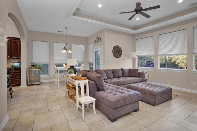11409 E Zoe Loop Dr, Montgomery, TX 77316 - living room featuring beverage cooler, a ceiling fan, a raised ceiling, recessed lighting, and arched walkways