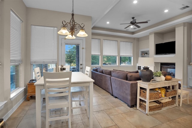 11409 E Zoe Loop Dr, Montgomery, TX 77316 - dining area featuring a ceiling fan, recessed lighting, a chandelier, baseboards, and a tray ceiling