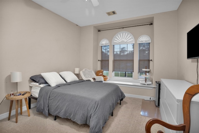 11409 E Zoe Loop Dr, Montgomery, TX 77316 - carpeted bedroom featuring baseboards and a ceiling fan