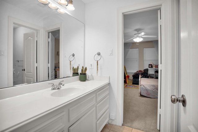 11409 E Zoe Loop Dr, Montgomery, TX 77316 - bathroom with tile patterned floors, ceiling fan, and vanity