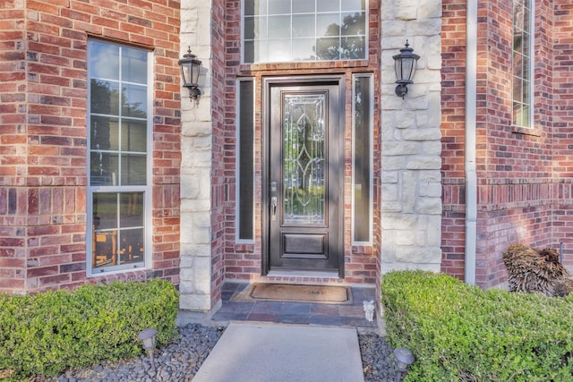 11409 E Zoe Loop Dr, Montgomery, TX 77316 - view of exterior entry featuring brick siding