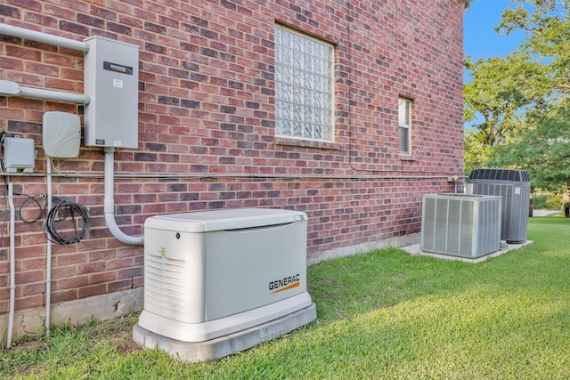 11409 E Zoe Loop Dr, Montgomery, TX 77316 - exterior view of a power unit, brick siding, and cooling unit