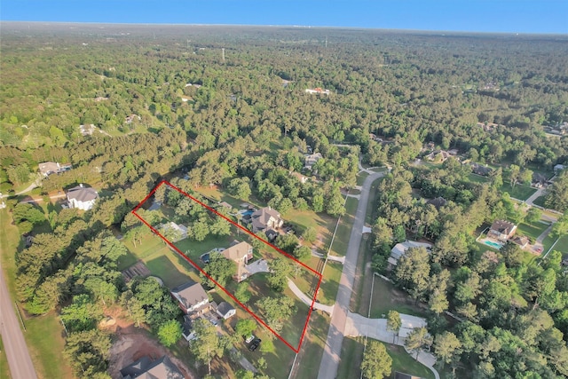 11409 E Zoe Loop Dr, Montgomery, TX 77316 - aerial view of property's location with a heavily wooded area and property boundaries highlighted