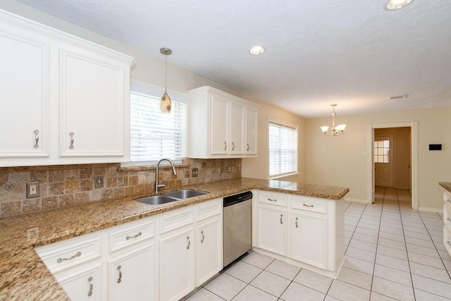 1103 Suwanee Ln, Houston, TX 77090 - kitchen with white cabinets, a sink, backsplash, dishwasher, and light tile patterned floors