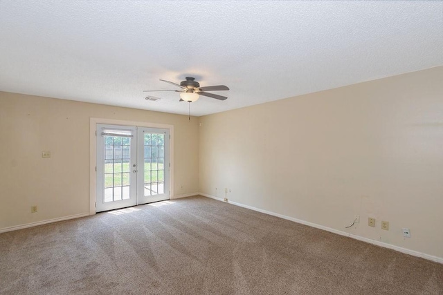 1103 Suwanee Ln, Houston, TX 77090 - spare room featuring carpet floors, baseboards, ceiling fan, and french doors
