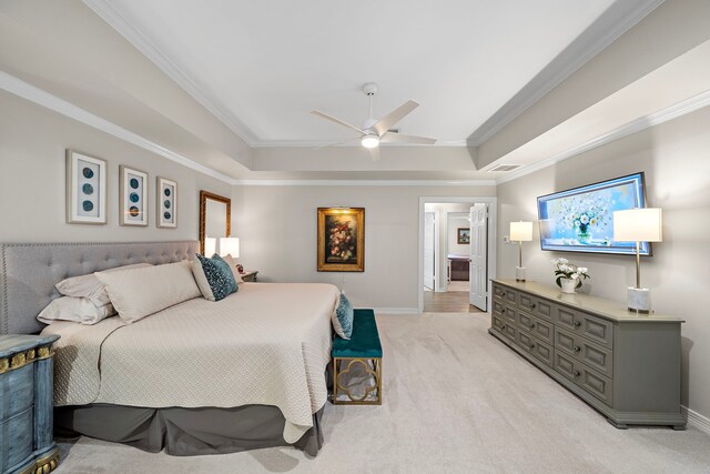bedroom with visible vents, ornamental molding, light carpet, baseboards, and a raised ceiling