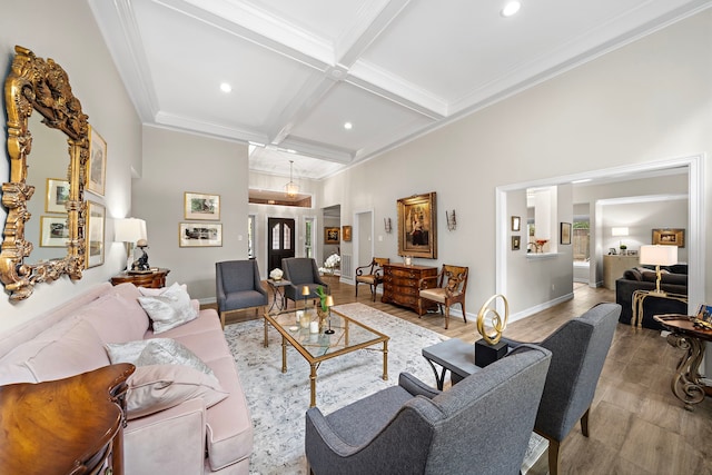 living area featuring beam ceiling, wood finished floors, baseboards, coffered ceiling, and recessed lighting