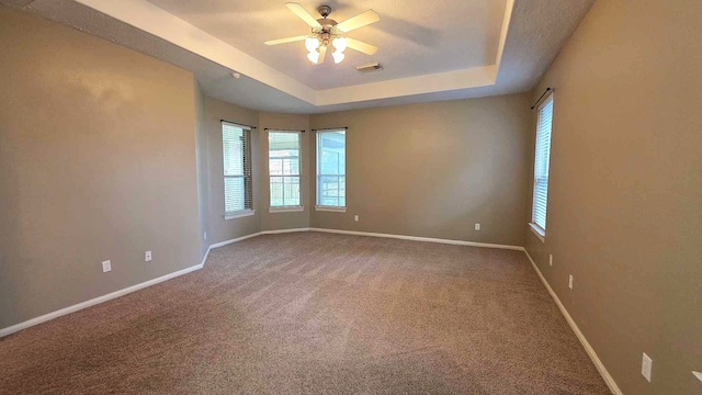 8931 Pine Shores Dr, Humble, TX 77346 - empty room with plenty of natural light, a ceiling fan, carpet, and baseboards