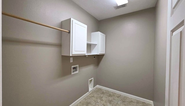 washroom with hookup for an electric dryer, washer hookup, visible vents, baseboards, and cabinet space
