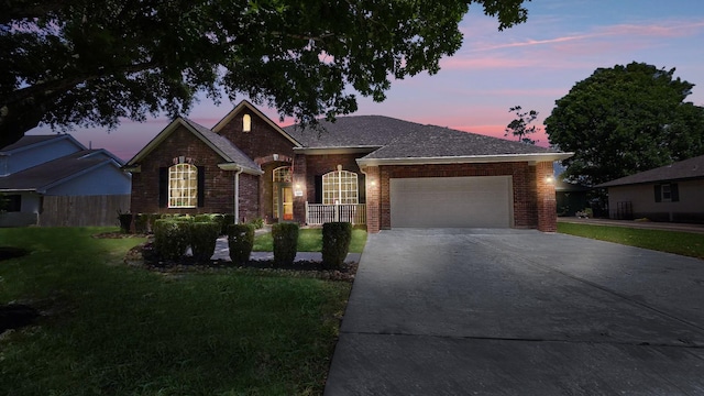 8931 Pine Shores Dr, Humble, TX 77346 - ranch-style home with a garage, brick siding, and driveway