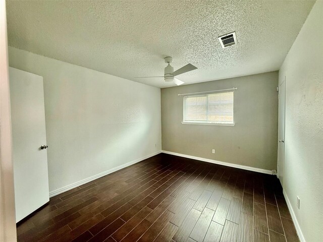 8818 Fern Valley Dr, Houston, TX 77044 - spare room featuring a ceiling fan, wood finished floors, baseboards, and a textured ceiling