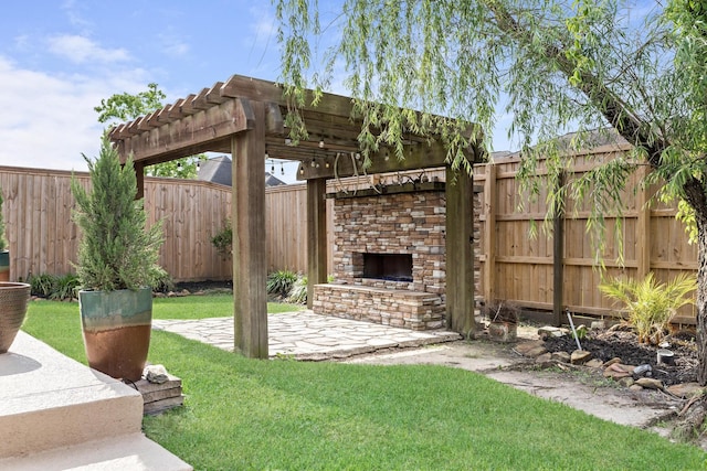 101 Sir Cameron, Lumberton, TX 77657 - view of yard featuring an outdoor stone fireplace, a pergola, and a patio area