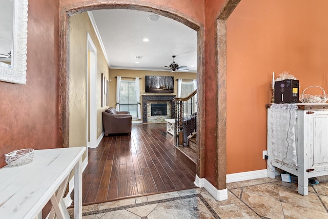101 Sir Cameron, Lumberton, TX 77657 - corridor with arched walkways, crown molding, baseboards, inlaid floor details, and recessed lighting