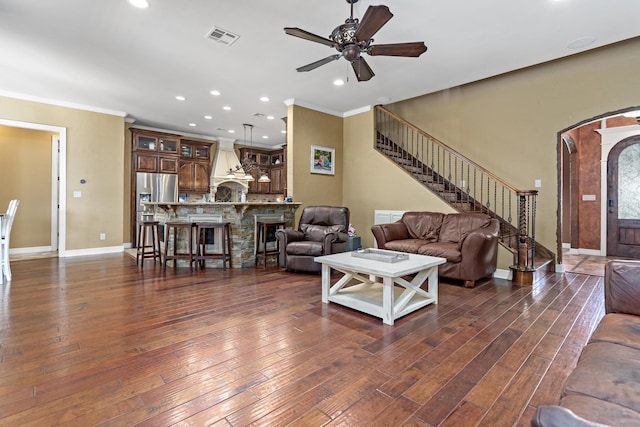 101 Sir Cameron, Lumberton, TX 77657 - living room featuring ceiling fan, dark wood finished floors, stairway, recessed lighting, and crown molding
