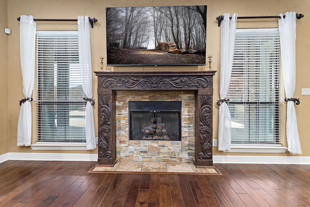 101 Sir Cameron, Lumberton, TX 77657 - detailed view of a fireplace, baseboards, and wood finished floors