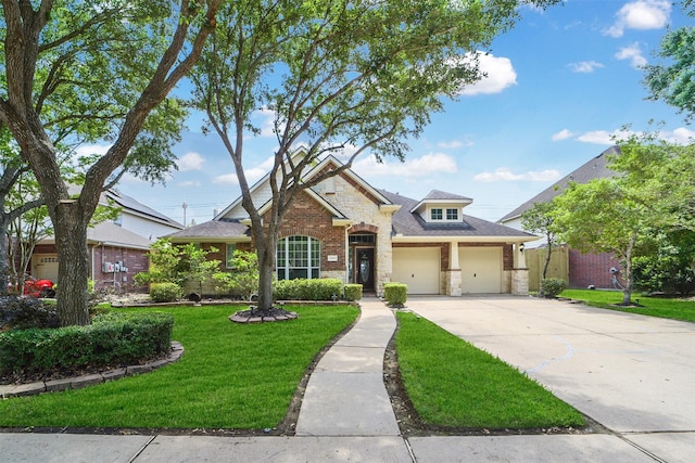 24119 Seventh Heaven Dr, Katy, TX 77494 - craftsman inspired home featuring concrete driveway, a front lawn, stone siding, an attached garage, and brick siding