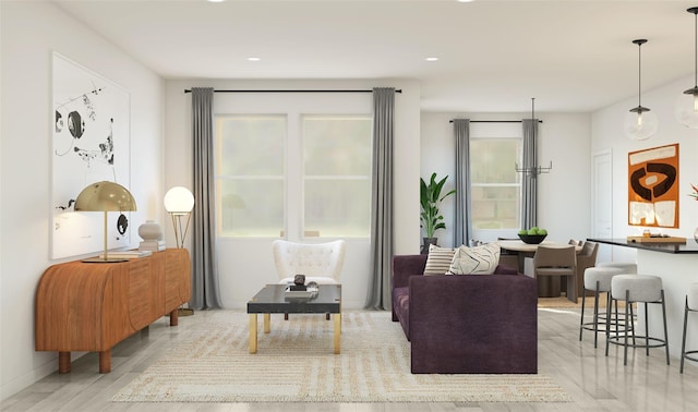 living area with recessed lighting and wood finished floors