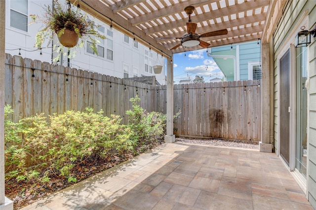 view of patio with a pergola, ceiling fan, and fence