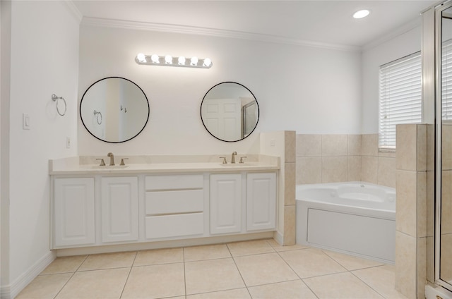 full bath with a garden tub, ornamental molding, and a sink