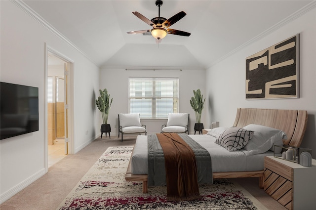 bedroom featuring vaulted ceiling, baseboards, light colored carpet, ensuite bath, and ornamental molding