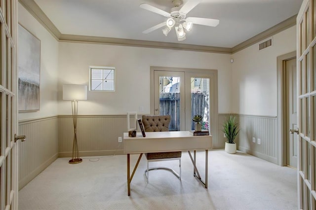 office space featuring a wainscoted wall, a wealth of natural light, and carpet floors