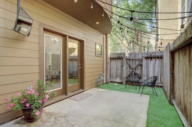 view of patio / terrace featuring a gate and fence