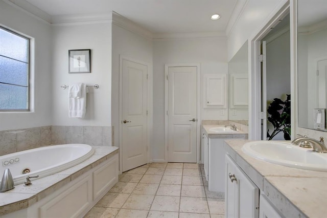 full bath with a whirlpool tub, two vanities, crown molding, and a sink