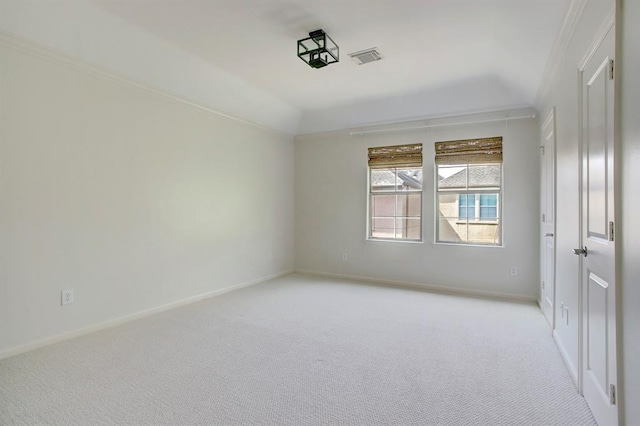 empty room with light colored carpet, baseboards, and visible vents