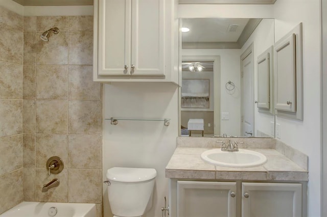 full bathroom with shower / bath combination, toilet, vanity, and ceiling fan