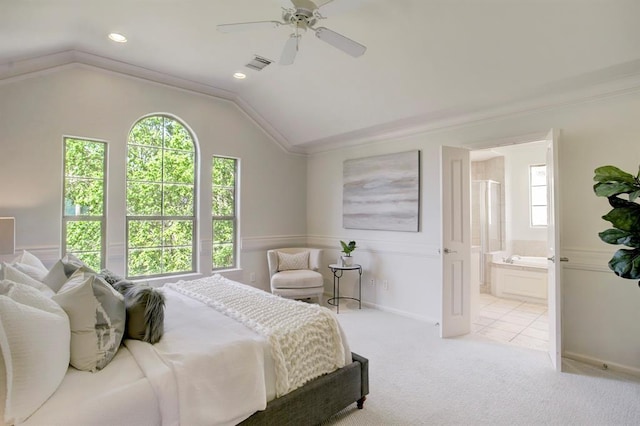 bedroom with vaulted ceiling, visible vents, and multiple windows