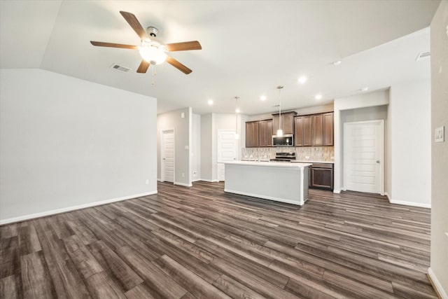 kitchen featuring a center island with sink, open floor plan, visible vents, recessed lighting, and appliances with stainless steel finishes