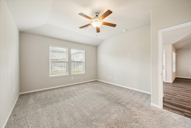 empty room featuring baseboards, visible vents, carpet floors, and ceiling fan