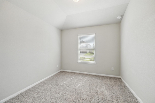 carpeted spare room with baseboards