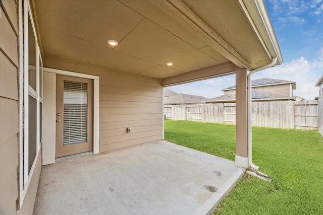 view of patio / terrace featuring fence