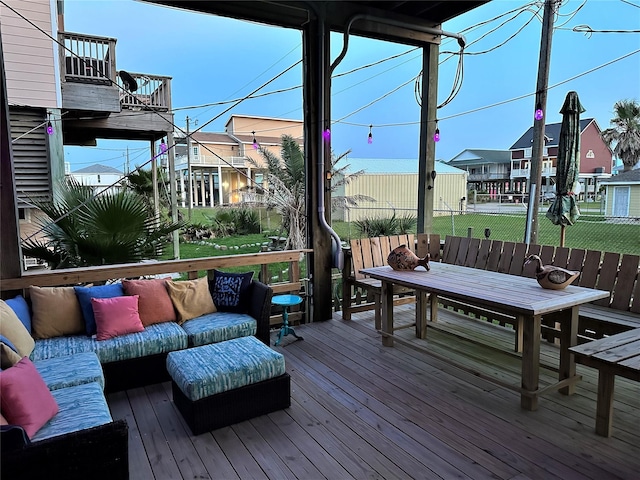 wooden deck with an outdoor living space and a residential view
