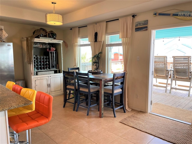 dining space with light tile patterned floors