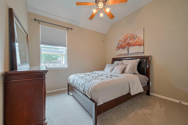 bedroom with baseboards, carpet floors, and lofted ceiling