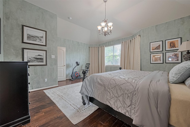bedroom with lofted ceiling, wood finished floors, and a chandelier