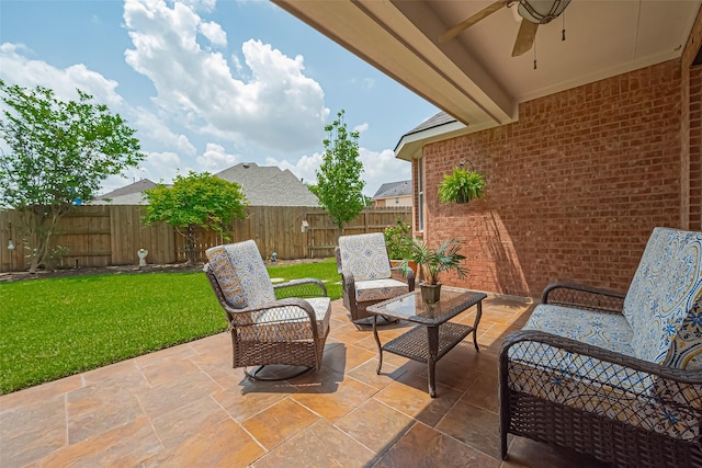 view of patio / terrace featuring an outdoor living space, ceiling fan, and a fenced backyard
