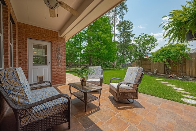 view of patio with a ceiling fan, outdoor lounge area, and a fenced backyard