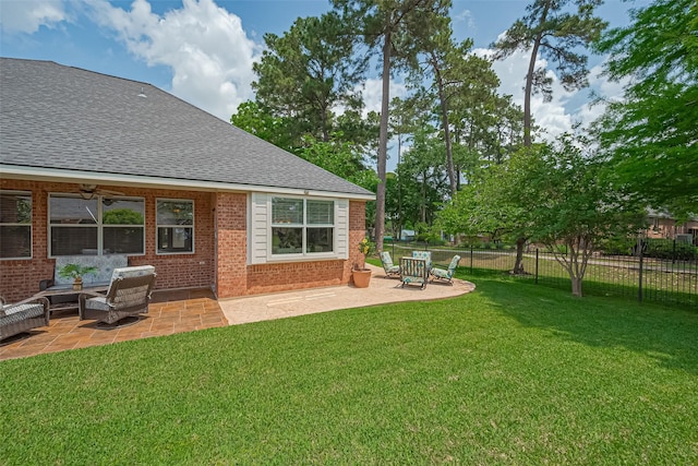 view of yard featuring an outdoor hangout area, a patio area, and fence