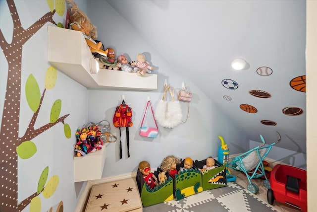 playroom with lofted ceiling