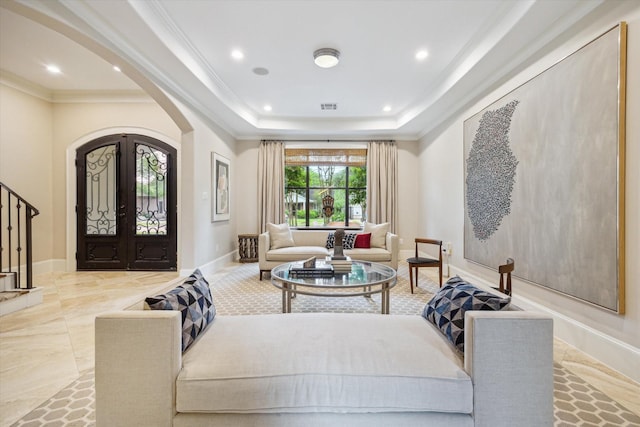 sitting room with arched walkways, recessed lighting, a tray ceiling, visible vents, and ornamental molding