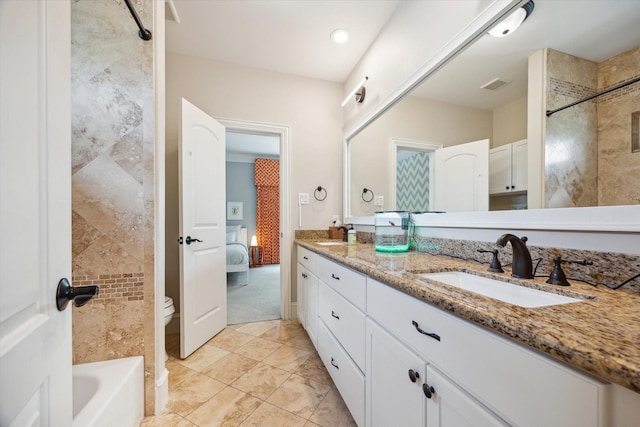 bathroom featuring a sink, a shower, double vanity, and visible vents