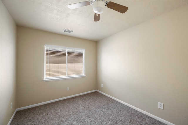 unfurnished room featuring baseboards, carpet flooring, and visible vents