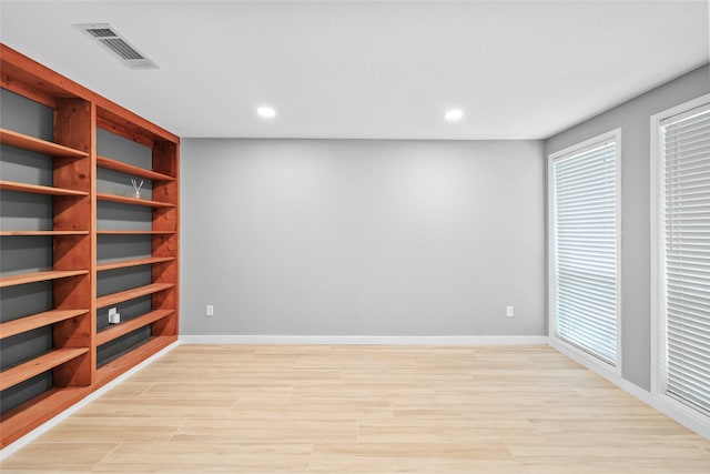 unfurnished bedroom with recessed lighting, light wood-style floors, and visible vents