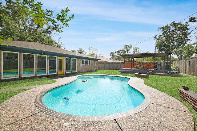 view of pool with a gazebo, a fenced in pool, a lawn, and a fenced backyard