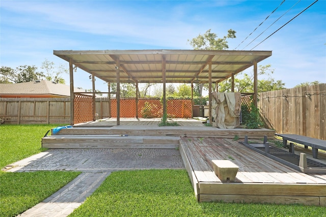 exterior space featuring a wooden deck and a fenced backyard